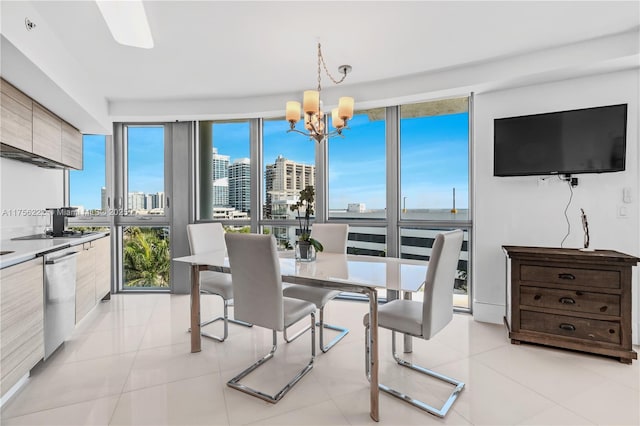 dining space with light tile patterned floors and a chandelier