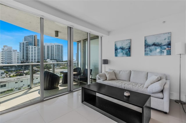 tiled living room featuring a city view and floor to ceiling windows