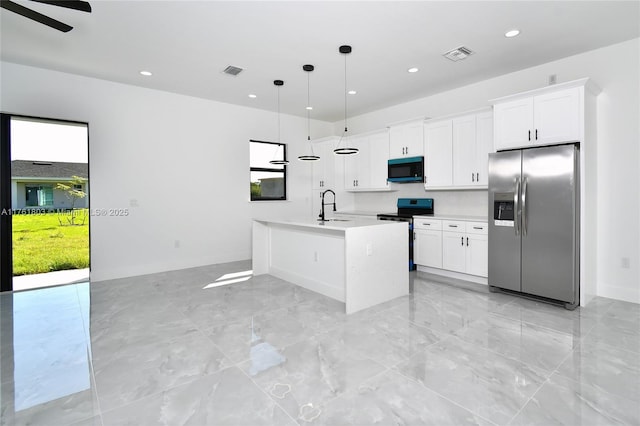 kitchen featuring a sink, stainless steel appliances, visible vents, and light countertops