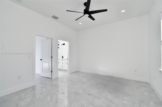 empty room featuring visible vents, marble finish floor, a ceiling fan, recessed lighting, and baseboards