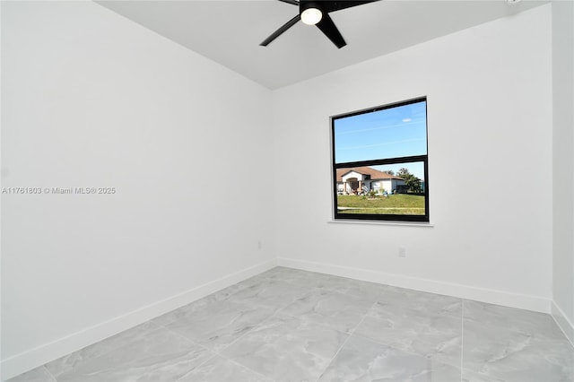 unfurnished room with baseboards and a ceiling fan