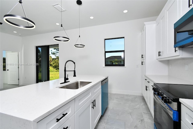 kitchen with a wealth of natural light, visible vents, electric stove, a sink, and dishwasher