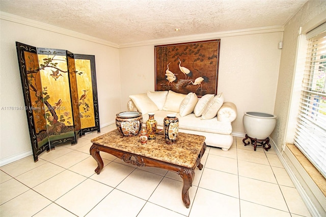 living area with light tile patterned flooring, a textured ceiling, baseboards, and ornamental molding