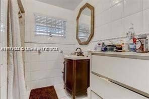 bathroom with vanity and a shower with shower curtain