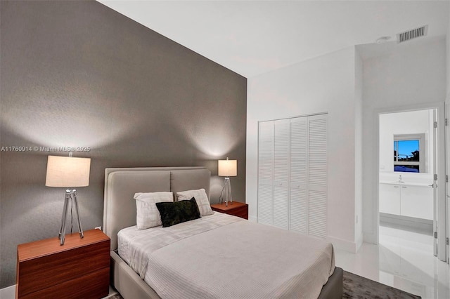 bedroom featuring visible vents and a closet