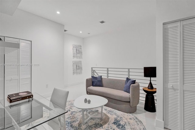 interior space with visible vents, recessed lighting, and baseboards