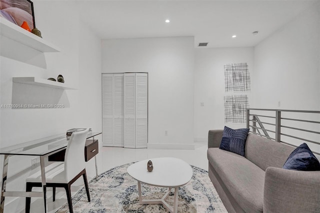 living area with visible vents and recessed lighting