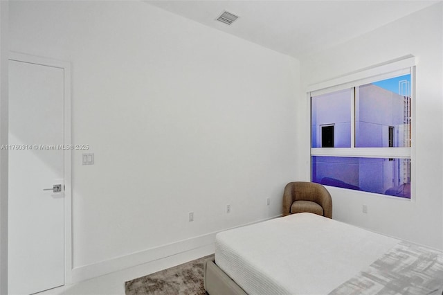bedroom featuring visible vents
