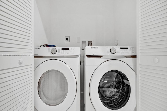 washroom with washer and dryer and laundry area