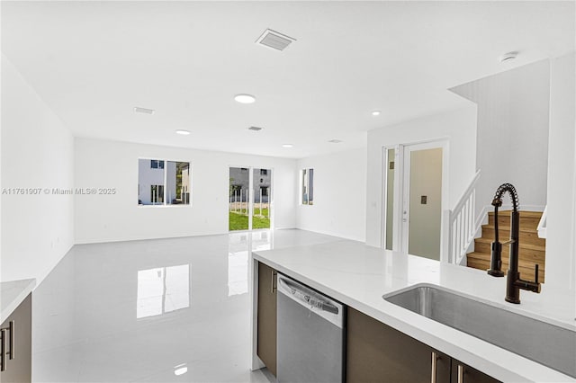 kitchen featuring visible vents, open floor plan, dishwasher, recessed lighting, and a sink