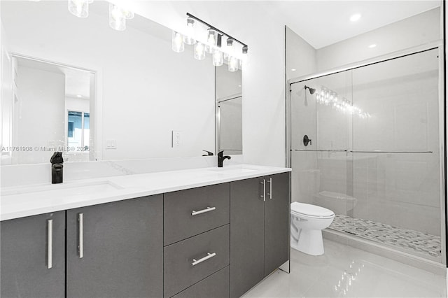 bathroom featuring a sink, toilet, and a shower stall