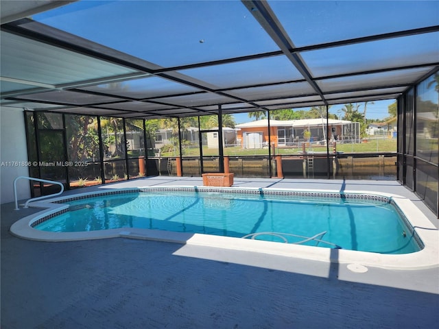 pool featuring a lanai and a patio