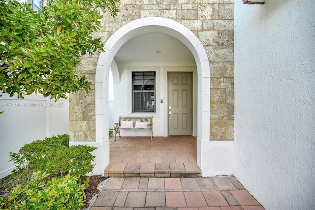 3489 W 110th Ter, Hialeah, FL 33018 - mediterranean / spanish-style house with stucco siding, decorative driveway, and stone siding