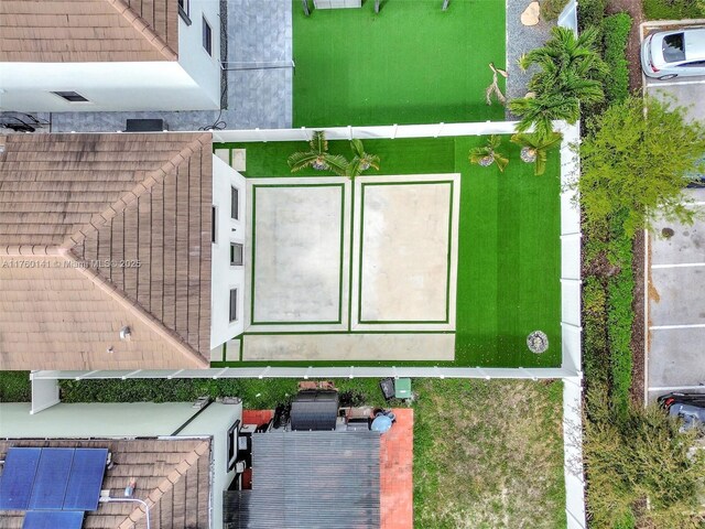 3489 W 110th Ter, Hialeah, FL 33018 - back of house with a patio, a fenced backyard, stucco siding, and a yard