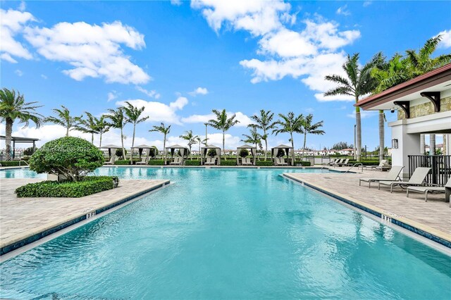 3489 W 110th Ter, Hialeah, FL 33018 - community pool featuring a patio area and fence