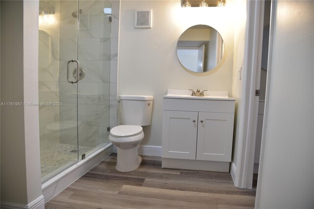 6070 W 18th Ave Unit 310, Hialeah, FL 33012 - full bathroom with a shower stall, toilet, wood finished floors, and vanity