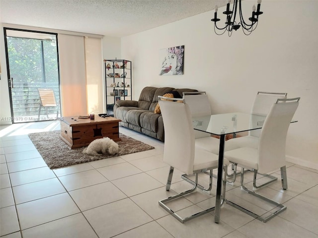 dining area featuring a wall of windows, a notable chandelier, light tile patterned flooring, and a textured ceiling