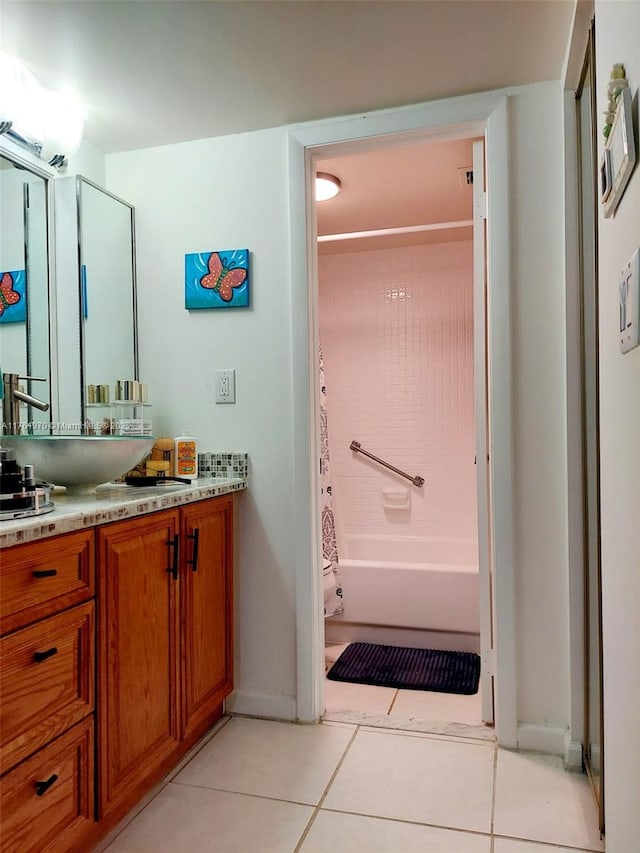 bathroom featuring shower / tub combo with curtain, vanity, and tile patterned flooring