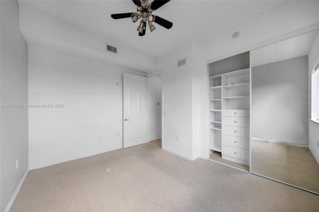unfurnished bedroom featuring carpet, visible vents, and baseboards
