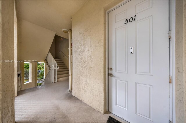 property entrance featuring stucco siding
