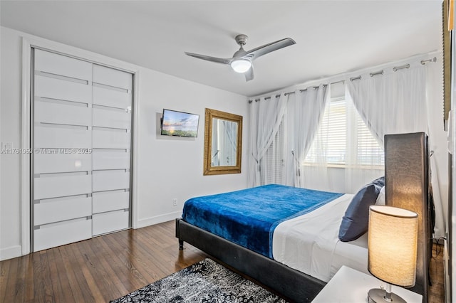 bedroom featuring baseboards, wood-type flooring, and ceiling fan