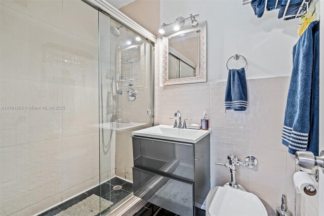 full bathroom featuring vanity, a shower stall, toilet, and tile walls