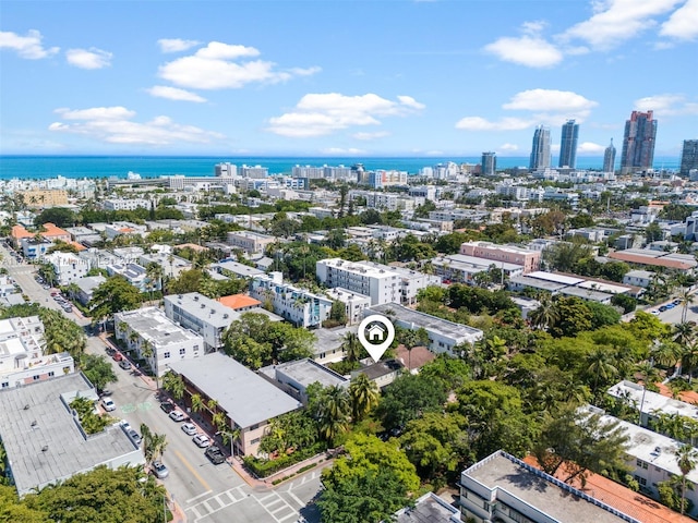 birds eye view of property with a city view and a water view