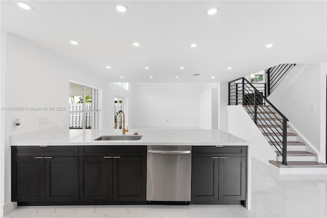 kitchen featuring a sink, stainless steel dishwasher, marble finish floor, and recessed lighting