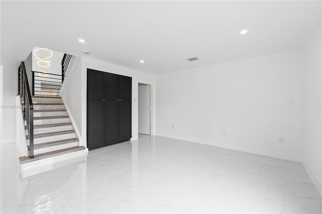 unfurnished room with visible vents, baseboards, stairs, recessed lighting, and marble finish floor