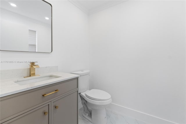 half bath with vanity, baseboards, ornamental molding, toilet, and marble finish floor