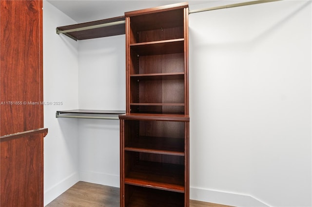 spacious closet with wood finished floors