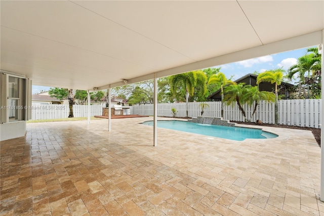 view of swimming pool featuring a fenced in pool, a patio, and a fenced backyard