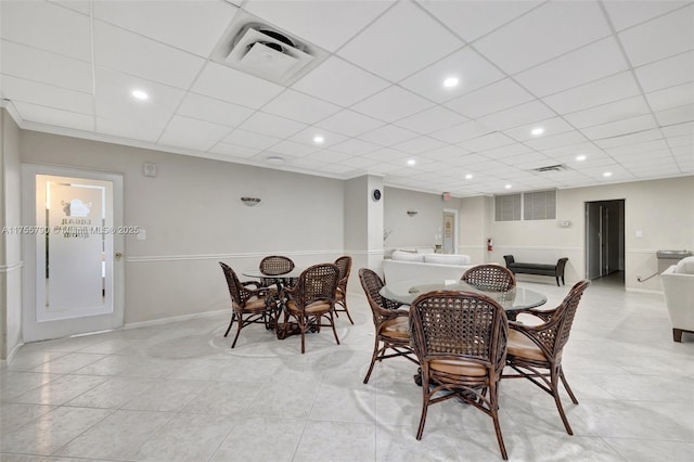 dining area with light tile patterned floors, visible vents, a paneled ceiling, and recessed lighting