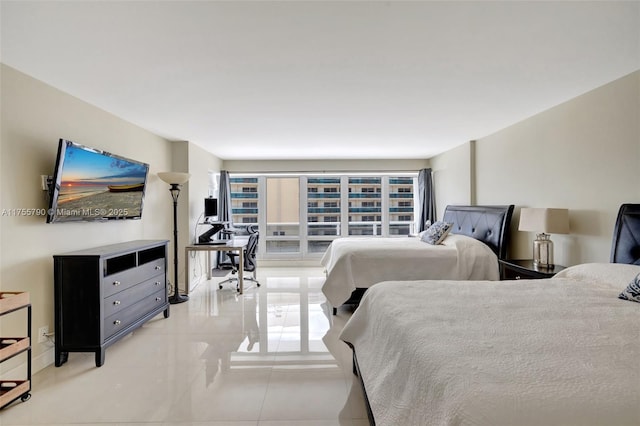 bedroom featuring light tile patterned floors