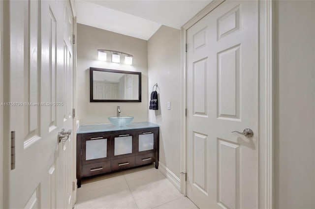 bathroom featuring tile patterned flooring, vanity, and baseboards