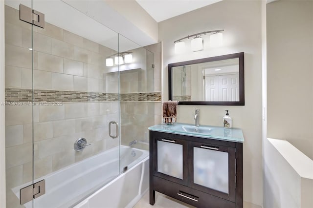 full bathroom featuring vanity and combined bath / shower with glass door