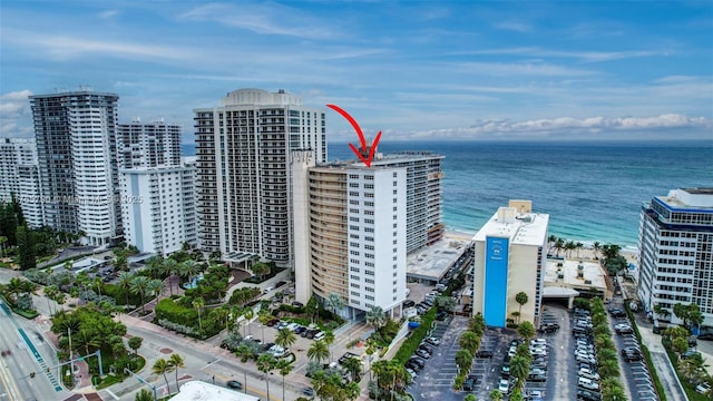 aerial view featuring a water view and a view of city