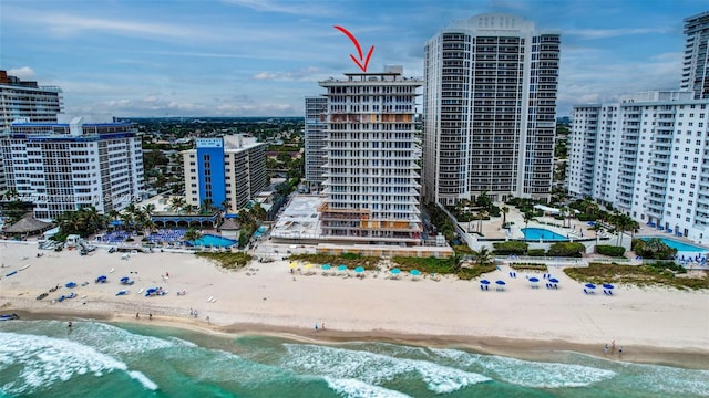 bird's eye view with a view of city, a water view, and a view of the beach