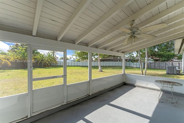 unfurnished sunroom featuring ceiling fan and vaulted ceiling with beams