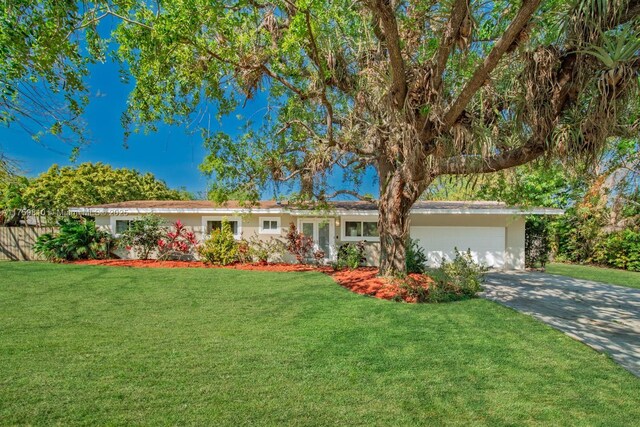 13700 SW 74th Ct, Palmetto Bay, FL 33158 - ranch-style home featuring an attached garage, a front yard, and concrete driveway