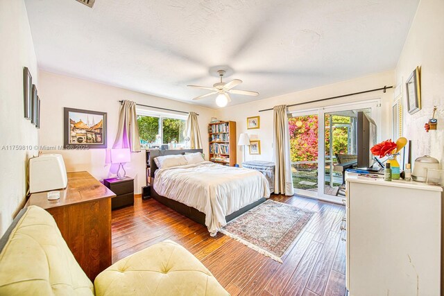 13700 SW 74th Ct, Palmetto Bay, FL 33158 - bedroom featuring access to outside, wood-type flooring, and a ceiling fan