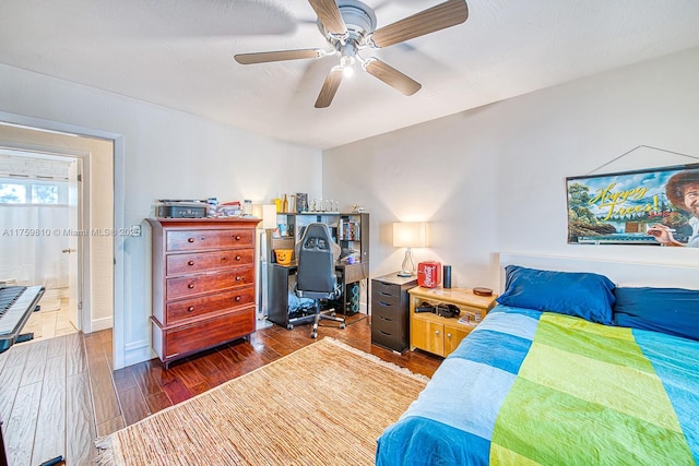 bedroom with ceiling fan and dark wood finished floors