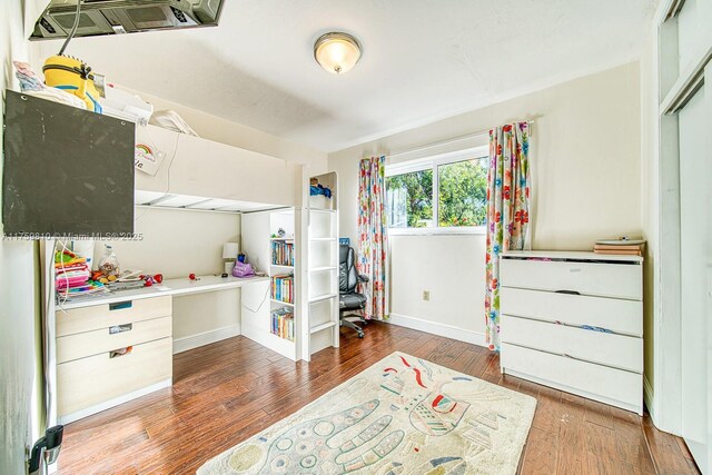 13700 SW 74th Ct, Palmetto Bay, FL 33158 - bedroom with wood finished floors and a desk