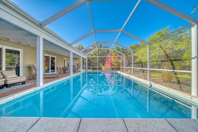 outdoor pool featuring a patio area and a lanai