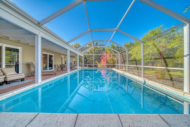 13700 SW 74th Ct, Palmetto Bay, FL 33158 - outdoor pool featuring a patio and glass enclosure