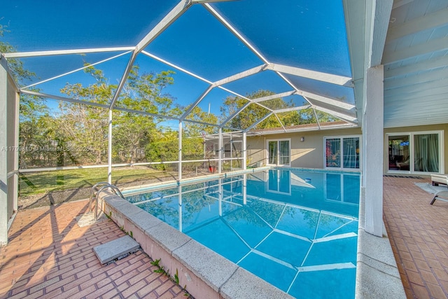 outdoor pool with a patio and a lanai