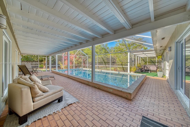 outdoor pool featuring a lanai and a patio area