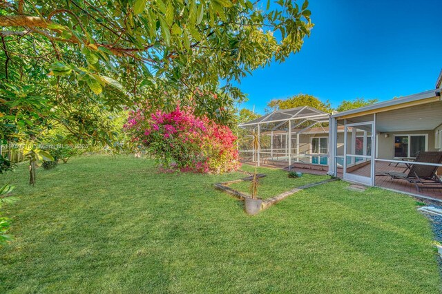 13700 SW 74th Ct, Palmetto Bay, FL 33158 - view of green lawn featuring a pool, a lanai, and a patio area