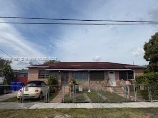 view of front of house with fence