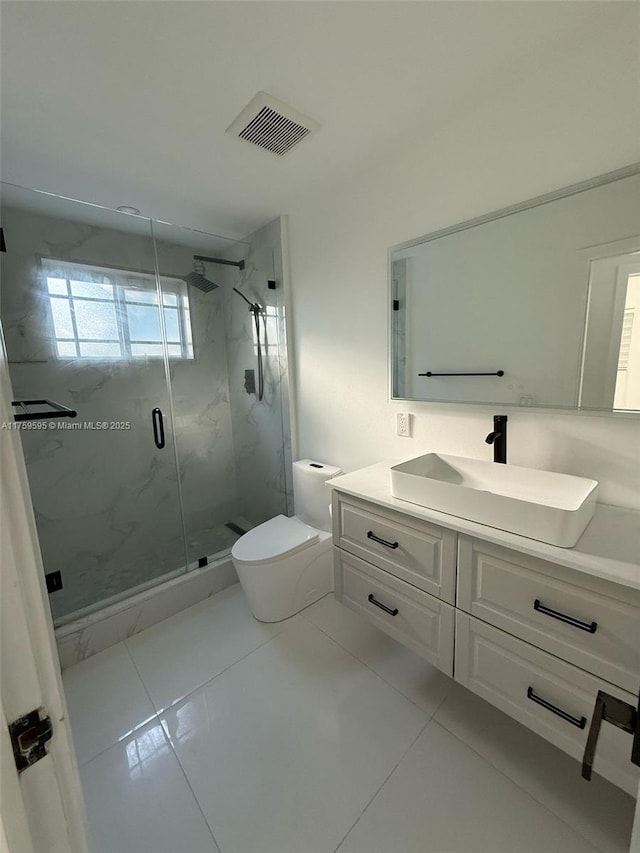 full bath featuring vanity, toilet, visible vents, and a marble finish shower